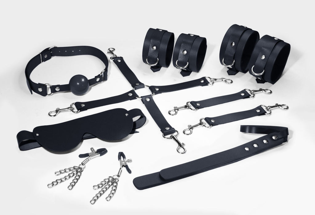 Feral Feelings (Україна) Набір Feral Feelings BDSM Kit 7 Black, наручники, поножі, конектор, маска, падл, кляп, затискачі