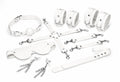 Feral Feelings (Україна) Набір Feral Feelings BDSM Kit 7 White, наручники, поножі, конектор, маска, падл, кляп, затискачі